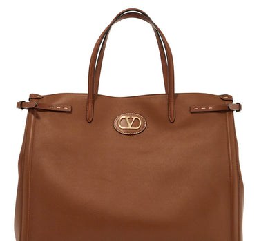 Valentino Garavani borsa cabas grande en peau marron minimaliste avec fibbie décoratif