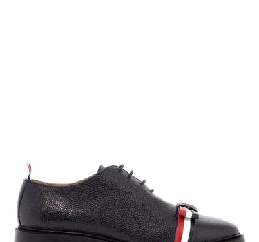 Thom Browne elegant wholecut shoes in black calfskin with rwb bow